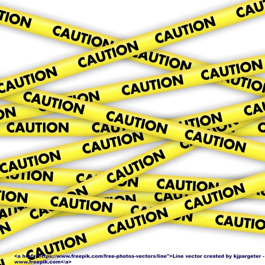 Background with lengths of yellow tape with caution written on it