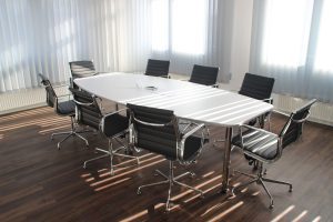 Stock photo of empty table and chairs in a business conference room.